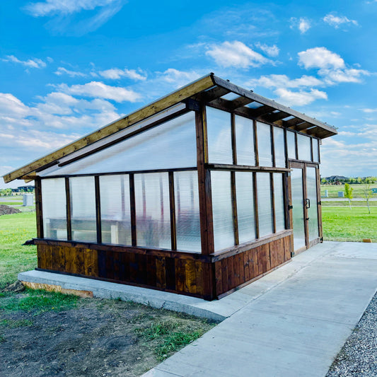 Compact greenhouse designed for urban patios or balconies, made with durable materials and optimal ventilation