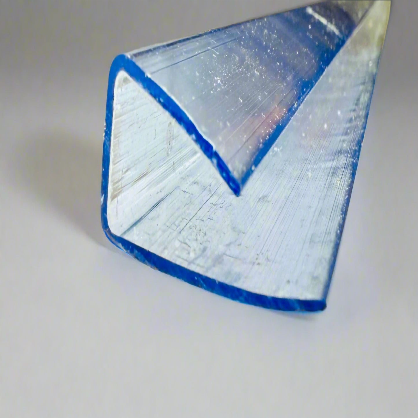 “Close-up of transparent U-shaped end cap for panel installation”