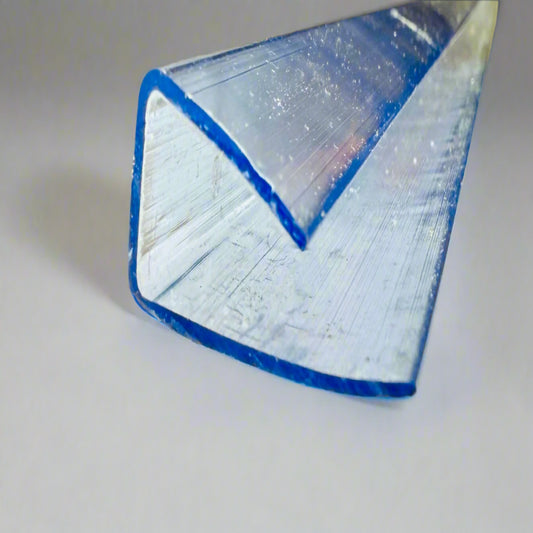 βClose-up of transparent U-shaped end cap for panel installationβ